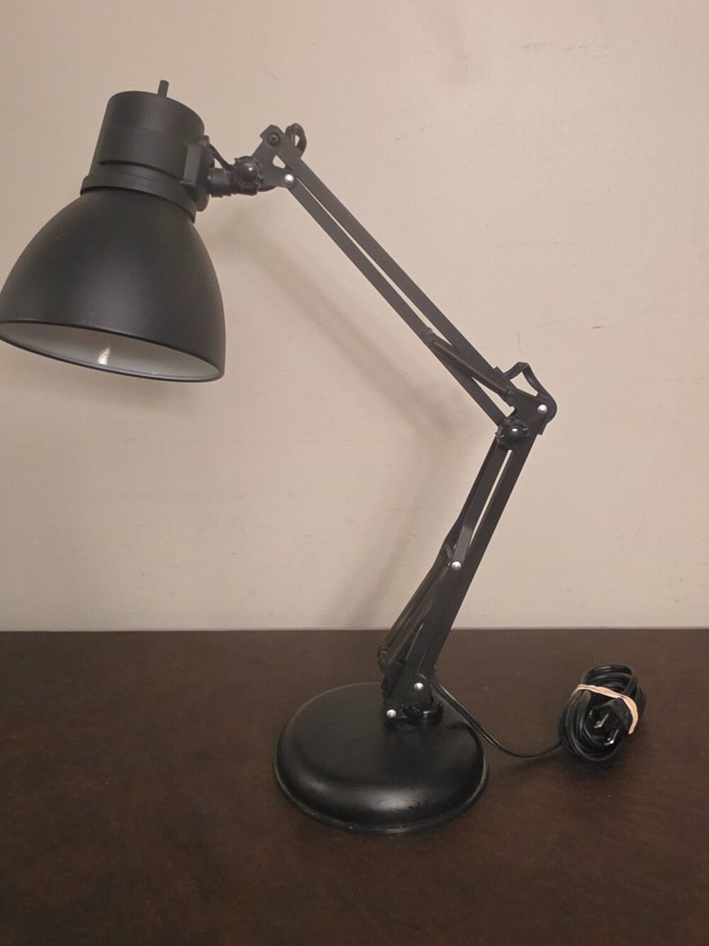 The Black Electric Architect SwingArm Lamp is a modern and sleek desk lamp